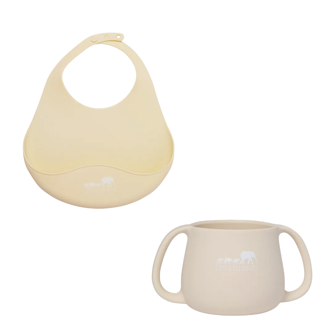 Beige bib and cup set on a white background