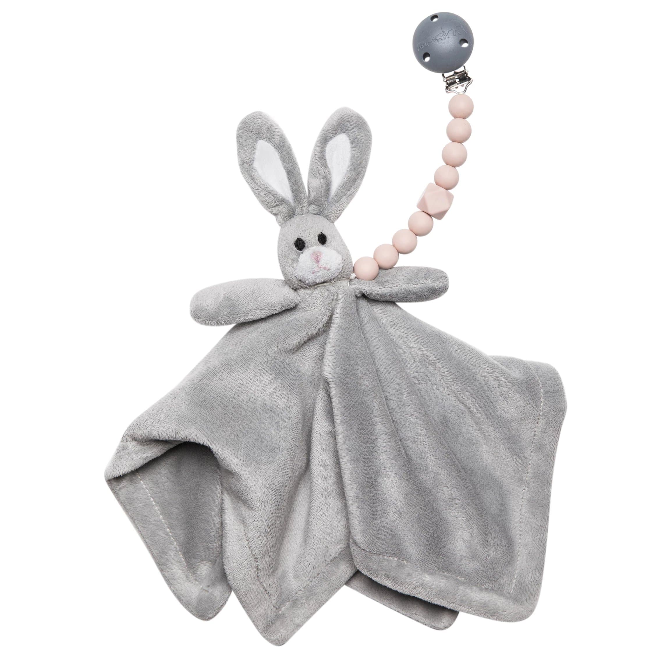 The Les Enfants Chewy Pacifier Clip pink attached to soft rabbit toy